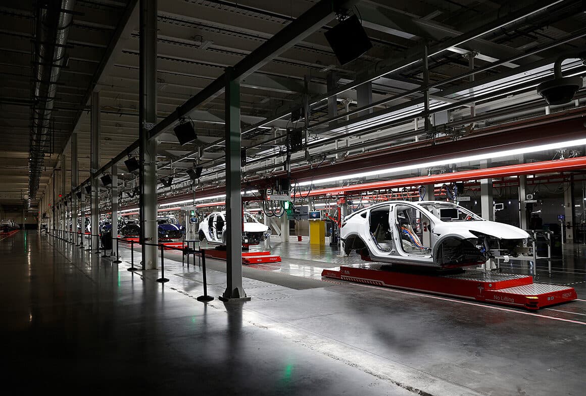 Vehicle bodies moving along an automated manufacturing production line