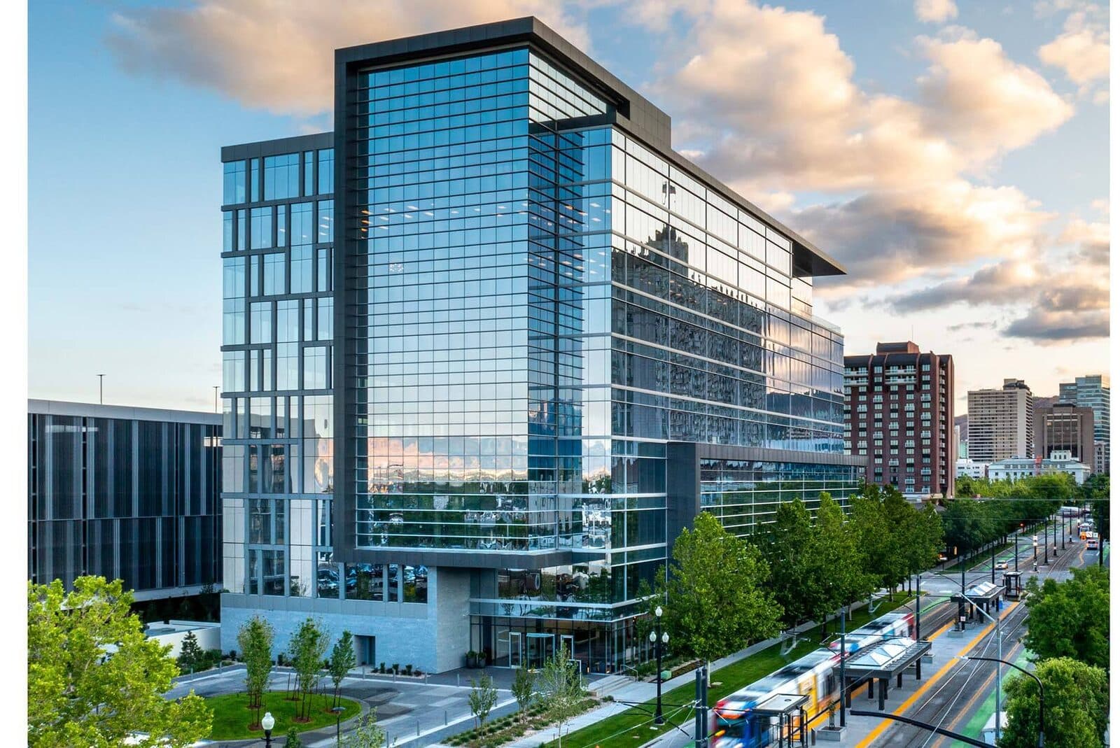 Modern glass corporate office building at dusk