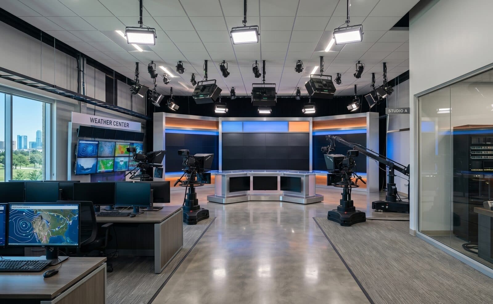 Television broadcast studio with cameras, studio lighting, and a weather center