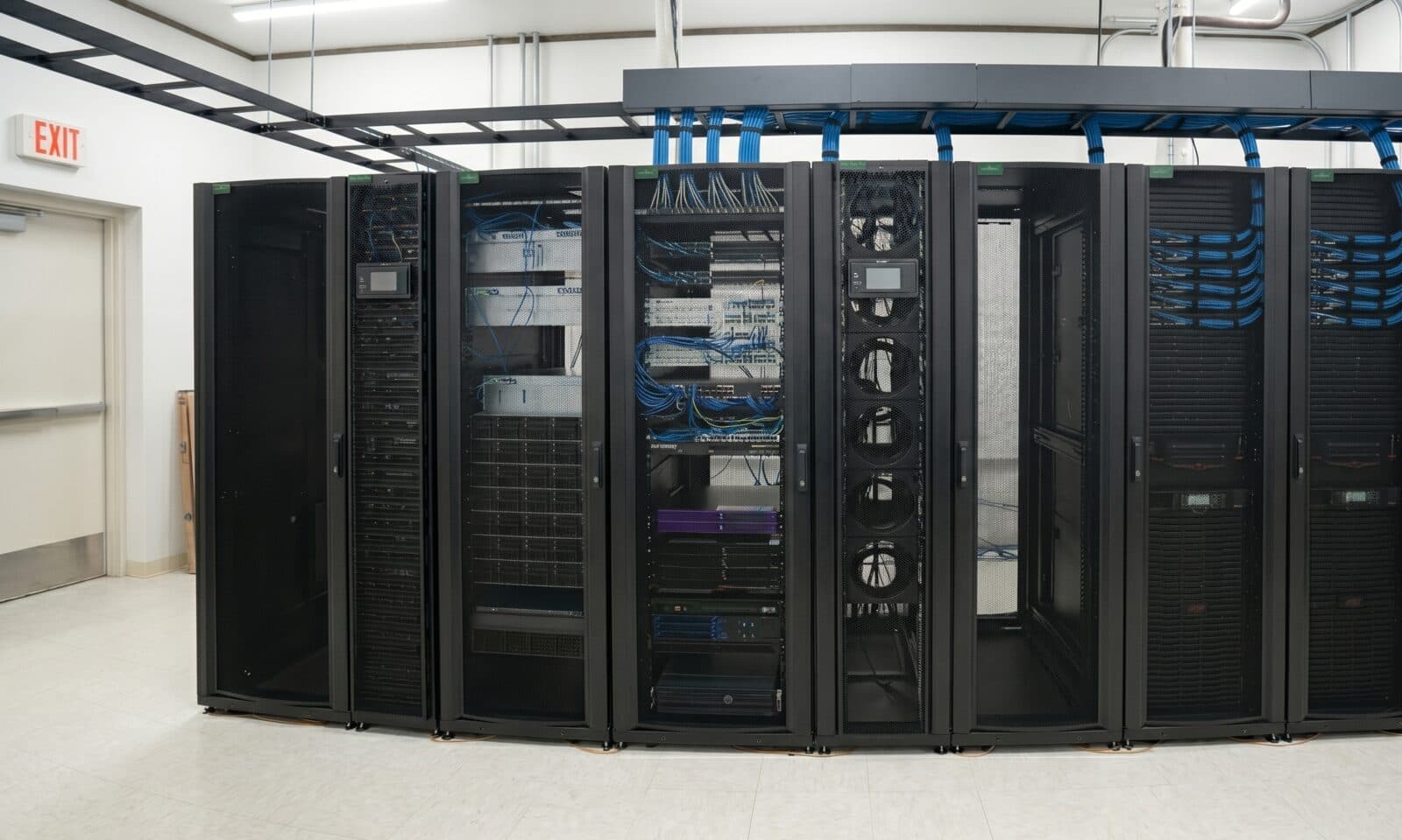 Row of black server and UPS cabinets in a regional bank's 2N-redundant data center